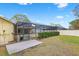 Screened-in patio visible from backyard at 3917 Appletree Dr, Valrico, FL 33594