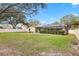 Expansive backyard with well-maintained lawn and screened lanai at 3917 Appletree Dr, Valrico, FL 33594