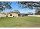 Large backyard with privacy fence and screened-in patio at 3917 Appletree Dr, Valrico, FL 33594