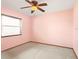 Bright bedroom featuring a ceiling fan, window for natural light and neutral carpet at 3917 Appletree Dr, Valrico, FL 33594