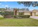 Charming single-story home featuring a well-manicured lawn and brick accents at 3917 Appletree Dr, Valrico, FL 33594