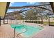 Relaxing screened-in pool area complete with a built-in spa and brick paving at 3917 Appletree Dr, Valrico, FL 33594
