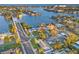 Stunning aerial view of waterfront home featuring private dock, pool, and lush landscaping at 3961 12Th Ne St, St Petersburg, FL 33703