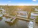 Breathtaking aerial shot of the property showcasing the backyard pool, boat dock, and serene waterfront at 3961 12Th Ne St, St Petersburg, FL 33703