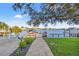 Beautiful backyard featuring pavers, lush lawn, mature landscaping, and dock access at 3961 12Th Ne St, St Petersburg, FL 33703