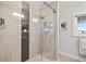 Updated shower with modern tile, glass door, and river views at 3961 12Th Ne St, St Petersburg, FL 33703