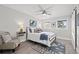 Comfortable bedroom with a queen bed, ceiling fan, and serene decor at 3961 12Th Ne St, St Petersburg, FL 33703