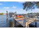 Private dock with boat lift and kayak storage on a sunny waterfront at 3961 12Th Ne St, St Petersburg, FL 33703