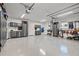 Organized garage featuring ample storage, work bench, and epoxy flooring at 3961 12Th Ne St, St Petersburg, FL 33703