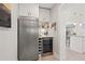 Kitchen area featuring stainless steel refrigerator, wine storage, and beverage cooler at 3961 12Th Ne St, St Petersburg, FL 33703