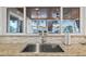Kitchen sink with view of the outside covered patio with ceiling fan and waterfront beyond at 3961 12Th Ne St, St Petersburg, FL 33703