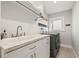 Well-equipped laundry area with ample counter space, sink, and modern appliances at 3961 12Th Ne St, St Petersburg, FL 33703