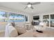Bright living room with a large picture window overlooking the water and neutral-toned furniture at 3961 12Th Ne St, St Petersburg, FL 33703