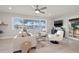 Bright living room with a large picture window overlooking the water and neutral-toned furniture at 3961 12Th Ne St, St Petersburg, FL 33703