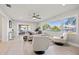 Bright living room featuring a large window, stylish furniture, and views of the outdoors at 3961 12Th Ne St, St Petersburg, FL 33703