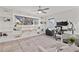 Bright office features built-in shelving, a large desk, and comfortable seating at 3961 12Th Ne St, St Petersburg, FL 33703