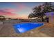 Backyard oasis featuring a sparkling pool with waterfront views and lounge chairs at 3961 12Th Ne St, St Petersburg, FL 33703