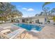 Relaxing backyard with a private pool, lounge chairs, and an outdoor seating area at 3961 12Th Ne St, St Petersburg, FL 33703