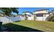 A spacious backyard with a well-maintained lawn and a privacy fence offers a serene outdoor space at 4017 W Nassau St, Tampa, FL 33607