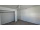 Carpeted bedroom with closet and neutral paint at 4017 W Nassau St, Tampa, FL 33607