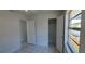 Bedroom with tile, closet, neutral paint, and light coming in from the windows at 4017 W Nassau St, Tampa, FL 33607
