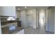 Bright kitchen featuring stainless steel appliances, granite countertops and white cabinets at 4017 W Nassau St, Tampa, FL 33607