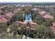 Lovely aerial shot showcasing community's pool, lush greenery, and tranquil pond, creating a serene setting at 4106 Central Sarasota Pkwy # 1023, Sarasota, FL 34238