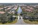 Community aerial view showcases a tranquil waterway winding through Mediterranean-style buildings and lush landscaping at 4106 Central Sarasota Pkwy # 1023, Sarasota, FL 34238