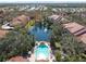 Gorgeous aerial view of a tranquil pond and community pool, perfect for relaxation and recreation at 4106 Central Sarasota Pkwy # 1023, Sarasota, FL 34238