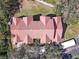 Overhead aerial view of a multi-Gathering building with a red roof and lush landscaping at 4106 Central Sarasota Pkwy # 1023, Sarasota, FL 34238