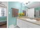 Bright bathroom with a light countertop, white cabinets, and view into the bedroom at 4106 Central Sarasota Pkwy # 1023, Sarasota, FL 34238