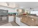 Well-lit kitchen with stainless steel appliances and a breakfast bar overlooking the living area at 4106 Central Sarasota Pkwy # 1023, Sarasota, FL 34238