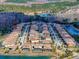 Aerial view of a neighborhood with lake views and manicured lawns at 4132 Woods Rider Loop, Odessa, FL 33556