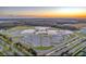Beautiful aerial shot of the school and the parking lots at sunset at 4132 Woods Rider Loop, Odessa, FL 33556