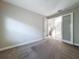 Neutral bedroom with carpet floors and an entrance to the foyer at 4132 Woods Rider Loop, Odessa, FL 33556