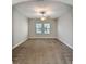 Carpeted bedroom with ceiling fan and windows providing ample natural light at 4132 Woods Rider Loop, Odessa, FL 33556