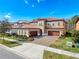 Beautiful two-story home featuring a brick driveway and a tile roof at 4132 Woods Rider Loop, Odessa, FL 33556