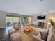 Cozy living room featuring modern tile floors and comfortable furniture at 4132 Woods Rider Loop, Odessa, FL 33556