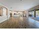 Open-concept kitchen and living area with seamless indoor-outdoor living at 4132 Woods Rider Loop, Odessa, FL 33556