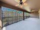 Large screened patio features ceiling fans and views of trees in the backyard at 4132 Woods Rider Loop, Odessa, FL 33556