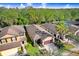An aerial of this home, showcasing its desirable location with a two-car garage in a vibrant and well-maintained community at 4512 Paper Mulberry Pl, Riverview, FL 33578