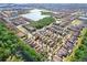 An aerial view showcases this home's location within a neighborhood featuring community lakes and well-maintained landscaping at 4512 Paper Mulberry Pl, Riverview, FL 33578