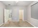Cozy bedroom with adjoining doors and natural light at 4512 Paper Mulberry Pl, Riverview, FL 33578