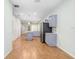 Bright kitchen with stainless steel appliances, island with marble countertops, and hardwood-style flooring at 4512 Paper Mulberry Pl, Riverview, FL 33578