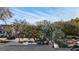 A tree obstructs the view of a single-story home with a backyard at 6223 Bayshore Blvd, Tampa, FL 33611
