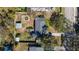 Aerial view of a large backyard featuring a shed, unique circular hot tub, and lush greenery at 6223 Bayshore Blvd, Tampa, FL 33611