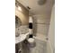 Cozy bathroom with tiled walls, a pedestal sink, and a shower-tub combo at 6223 Bayshore Blvd, Tampa, FL 33611