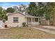 Charming single-story home featuring a quaint front porch and lush yard at 628 30Th N Ave, St Petersburg, FL 33704