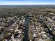 Wide aerial view showcases a neighborhood with homes situated along canals, surrounded by nature, offering waterfront lifestyles at 6291 Sebring St, Weeki Wachee, FL 34607