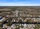 Expansive aerial view of a residential community highlighting canal-front homes with easy water access and tropical surroundings at 6291 Sebring St, Weeki Wachee, FL 34607